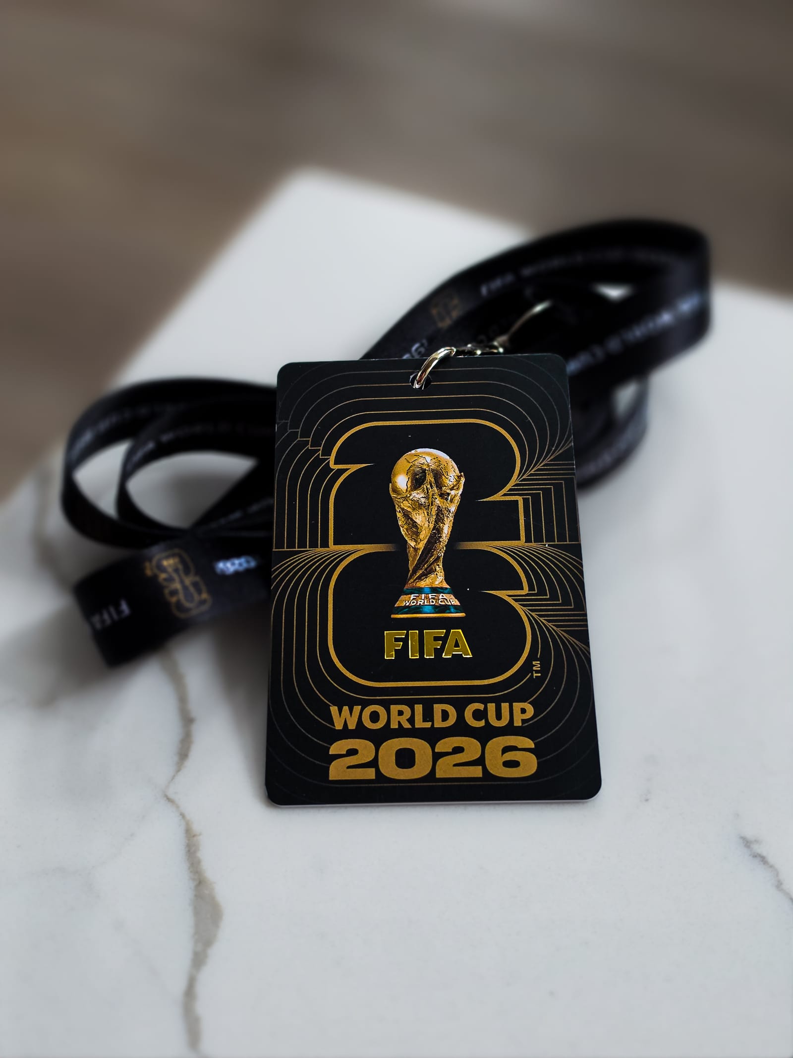 A FIFA World Cup 2026 matchday lanyard and credential resting on a counter the day after the Seattle match